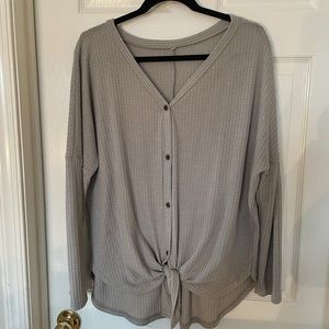 Soft grey v-neck with knot in the front.